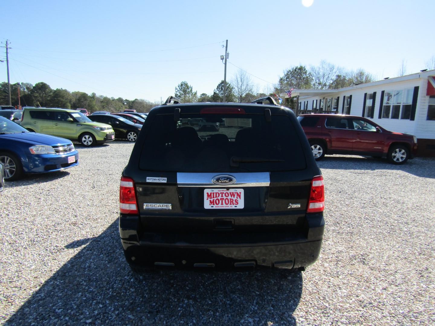 2010 Black Ford Escape Limited FWD (1FMCU0EG8AK) with an 3.0L V6 DOHC 24V engine, Automatic transmission, located at 15016 S Hwy 231, Midland City, AL, 36350, (334) 983-3001, 31.306210, -85.495277 - Photo#6